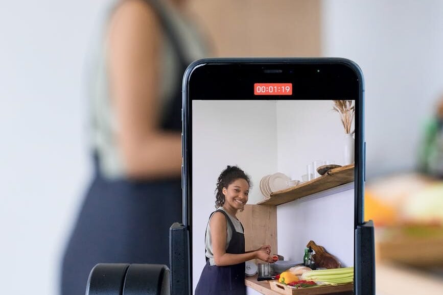 woman vlogging while preparing food in the kitchen